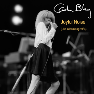 http://www.mig-music.de/wp-content/uploads/2020/03/CarlaBley_JoyfulNoise_LiveInHamburg1984_300px72dpi.png